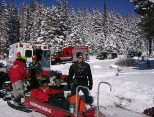 Mountain rescue team members and equipment stage at command