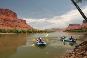 Team in two rubber duckies on final paddle in the Colorado River