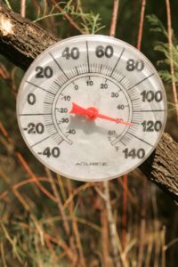 A thermometer shows a temperature of 120 degrees F.